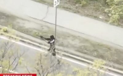 Gunman shot by trooper and civilian after opening fire on Memorial Drive in Cambridge, more than 60 rounds were fired by the attacker